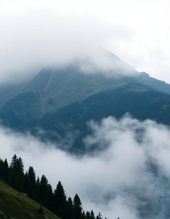 Mountain landscape with clouds and fog. Caucasus, Dombay.