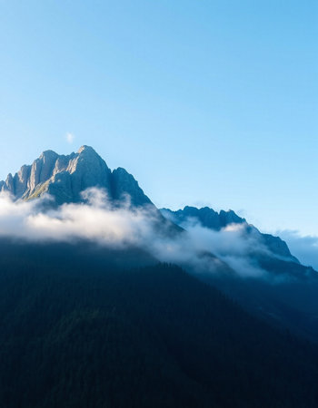mountain peak in the clouds at sunrise in the alps, Switzerlandの写真素材