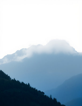 Silhouette of mountains and fog on the hillside on white backgroundの写真素材