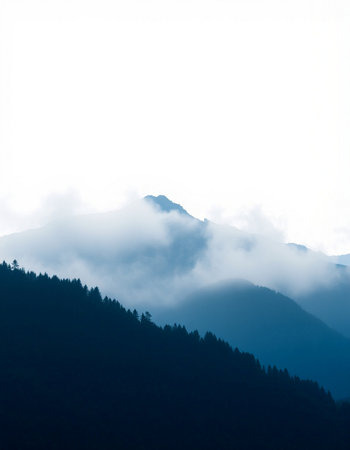 Silhouette of a mountain range covered with fog in the morning