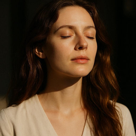 Portrait of a beautiful young brunette woman with closed eyes.