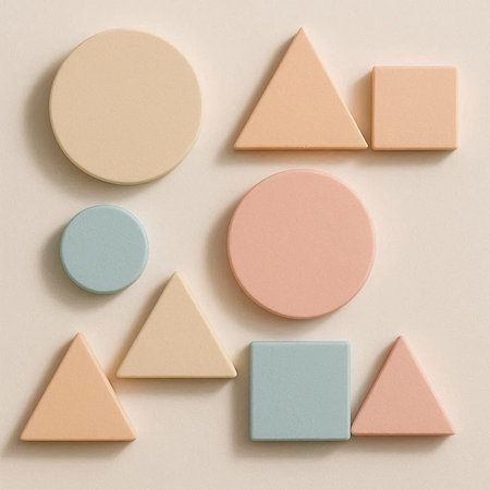 Colorful geometric shapes on pastel beige background. Flat lay, top view.
