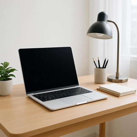 Laptop with blank screen on wooden table in office, mockup