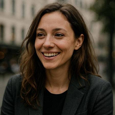 Close up portrait of a beautiful woman smiling at the camera outdoors.