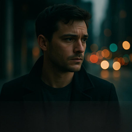 Portrait of a handsome young man in the city at night.