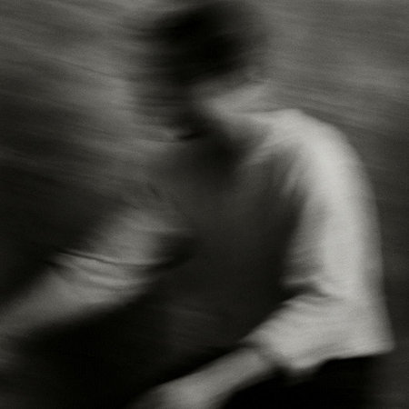 abstract black and white image of a man running in the streetの写真素材