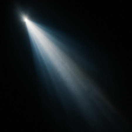 Abstract image of a bright spotlights on a black background. Bright rays of light.
