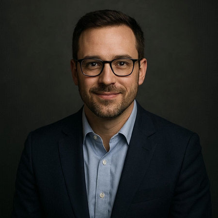 Portrait of a handsome business man in a suit on a dark background