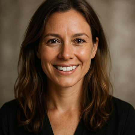 Portrait of a middle-aged woman smiling at the camera.