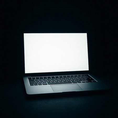Laptop with blank white screen on black background. 3d rendering