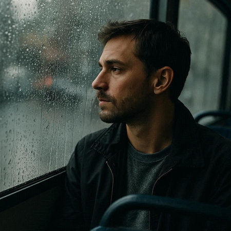 Portrait of a man in a bus. Rainy day.