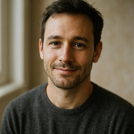 Portrait of a handsome man looking at the camera and smiling.