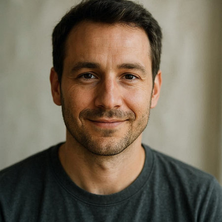 Portrait of handsome man smiling and looking at camera. Close up.