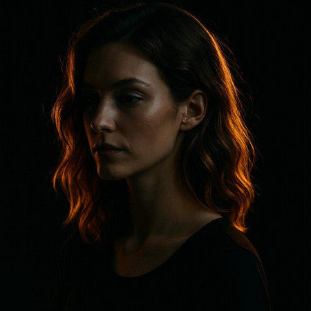 Portrait of a beautiful young woman on a black background in the studio