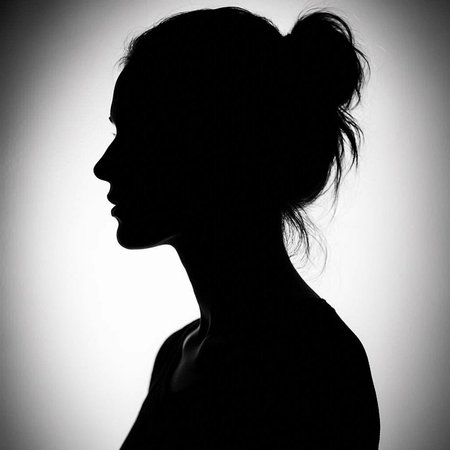Silhouette of a beautiful young woman in black and white.