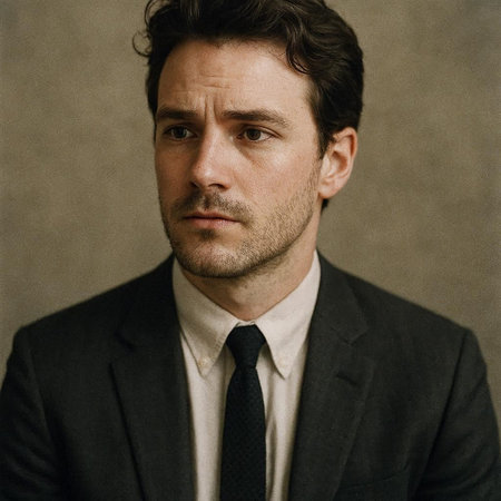 Portrait of a handsome man in a suit on a dark background