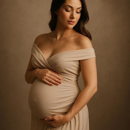 Pregnant woman holding her belly. Pregnancy, motherhood and expectation concept