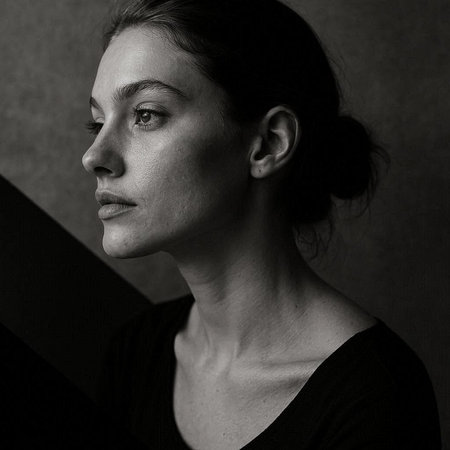 Portrait of a beautiful young woman. Studio shot. Black and white.