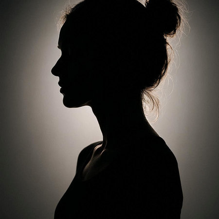 Silhouette of a young woman in profile. Studio shot.