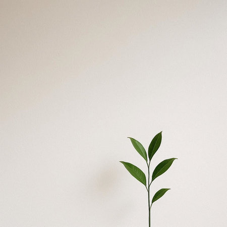 Creative layout made of green leaves on beige background. Flat lay, top view minimal concept.