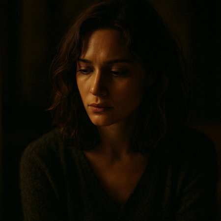 Portrait of a beautiful woman with long brown hair in a dark room