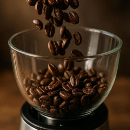 Coffee beans in a coffee grinder on a wooden background