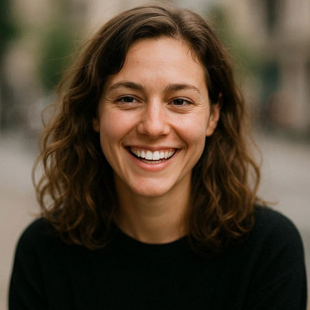 Portrait of a beautiful young woman with curly hair smiling at the camera