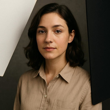 Portrait of a young woman in a shirt on a dark background