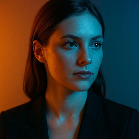 Close-up portrait of a beautiful young woman in a blue light