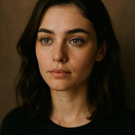 Portrait of a young woman with brown eyes. Studio shot.