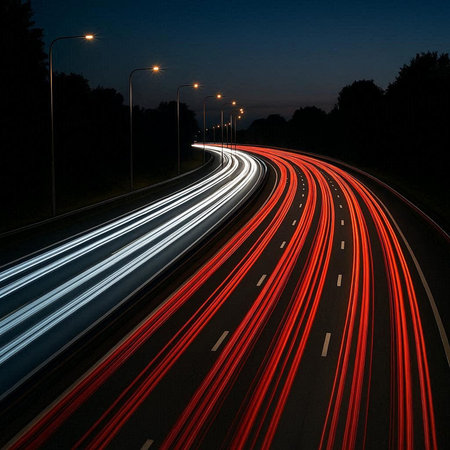 Car light trails on the road at night. Long exposure photo.