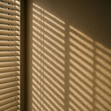 sunlight through window blinds with shadow on the wall, abstract background