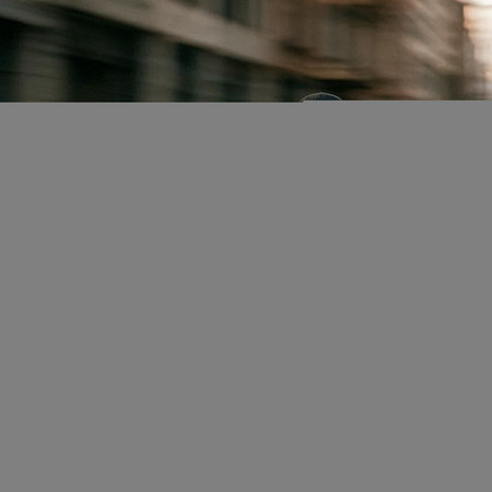 Close-up of a man running in the street. Motion blur