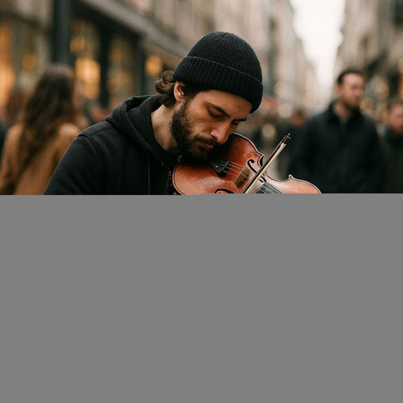 Street musician playing the violin in the city. Street music concept.の写真素材
