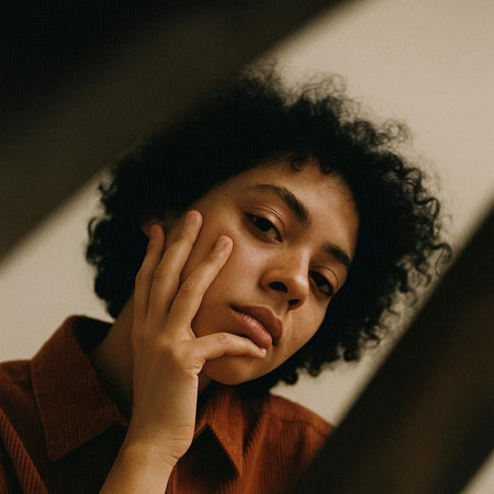 Portrait of a young beautiful african american woman with curly hair