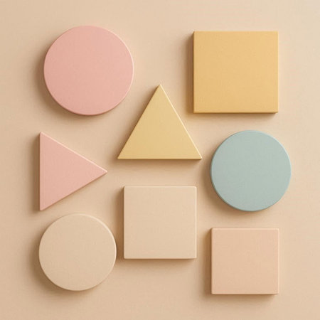 Colorful geometric shapes on pastel beige background. Flat lay, top view.
