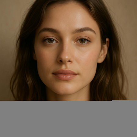 Portrait of young beautiful woman with long brown hair. Studio shot.の写真素材