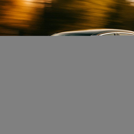 car on the road with motion blur background,vintage color tone