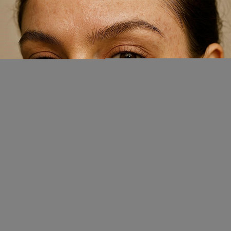 Close up portrait of a young woman with freckles on her face
