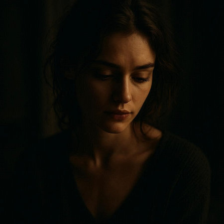 Portrait of a sad woman in a dark room. Dark background.