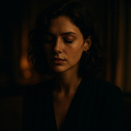 Portrait of a beautiful brunette woman in a dark room.