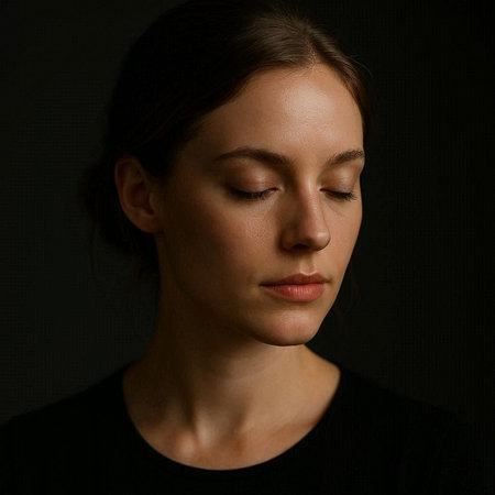 Portrait of a young woman with closed eyes on a dark background