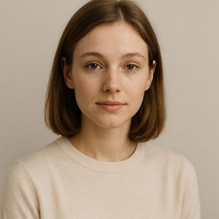 Portrait of a beautiful young woman in a beige sweater.