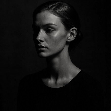 Portrait of a beautiful young woman. Studio shot. Black and white.