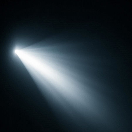 abstract scene with rays of light and smoke on a dark background