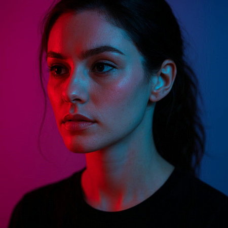 Portrait of beautiful young woman in neon light. Studio shot.
