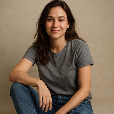Portrait of a beautiful young woman with long brown hair and blue jeans