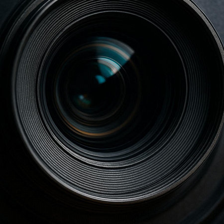 close-up of a camera lens on a dark background, macro