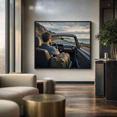 Man sitting in the car and looking at the pictures on the wall