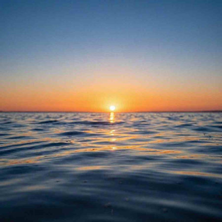 Sunset on the sea. The sun is reflected in the water.